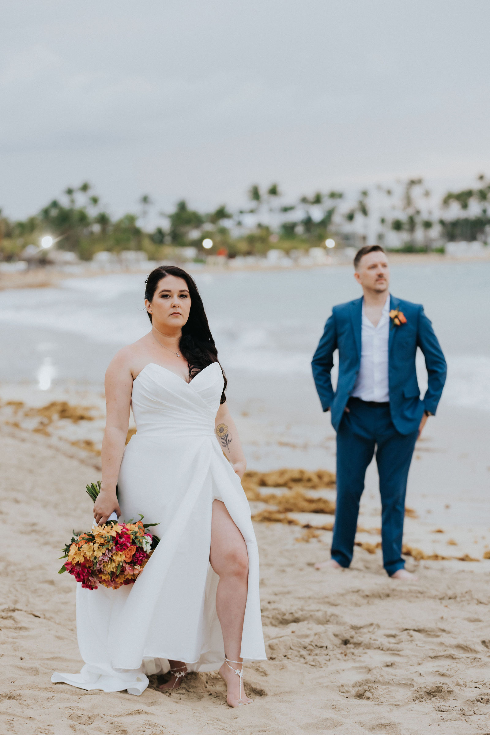 Portrait of the bride in a satin gown on the Punta Cana shoreline