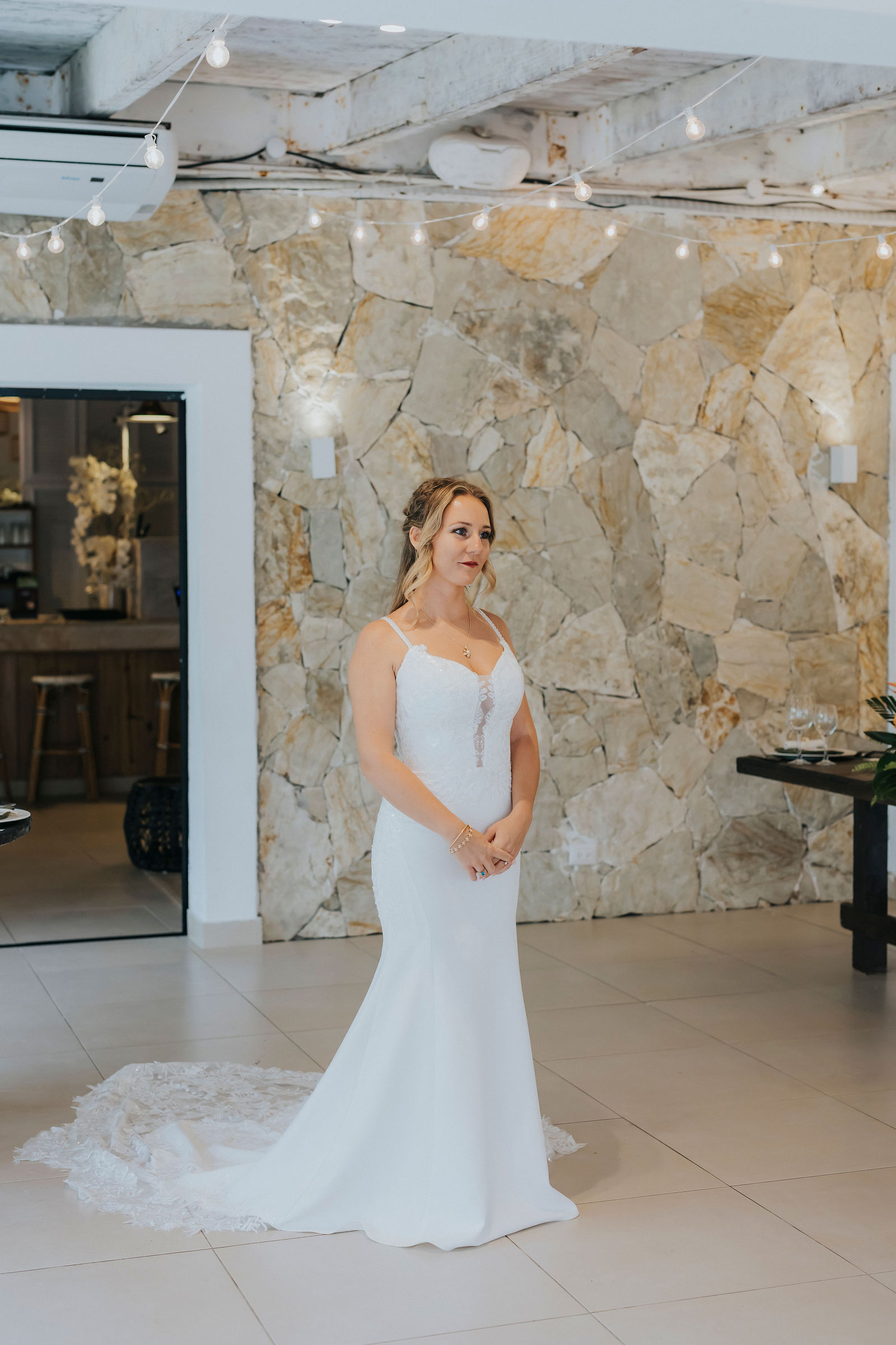 Bride waiting in the doorway before her first look
