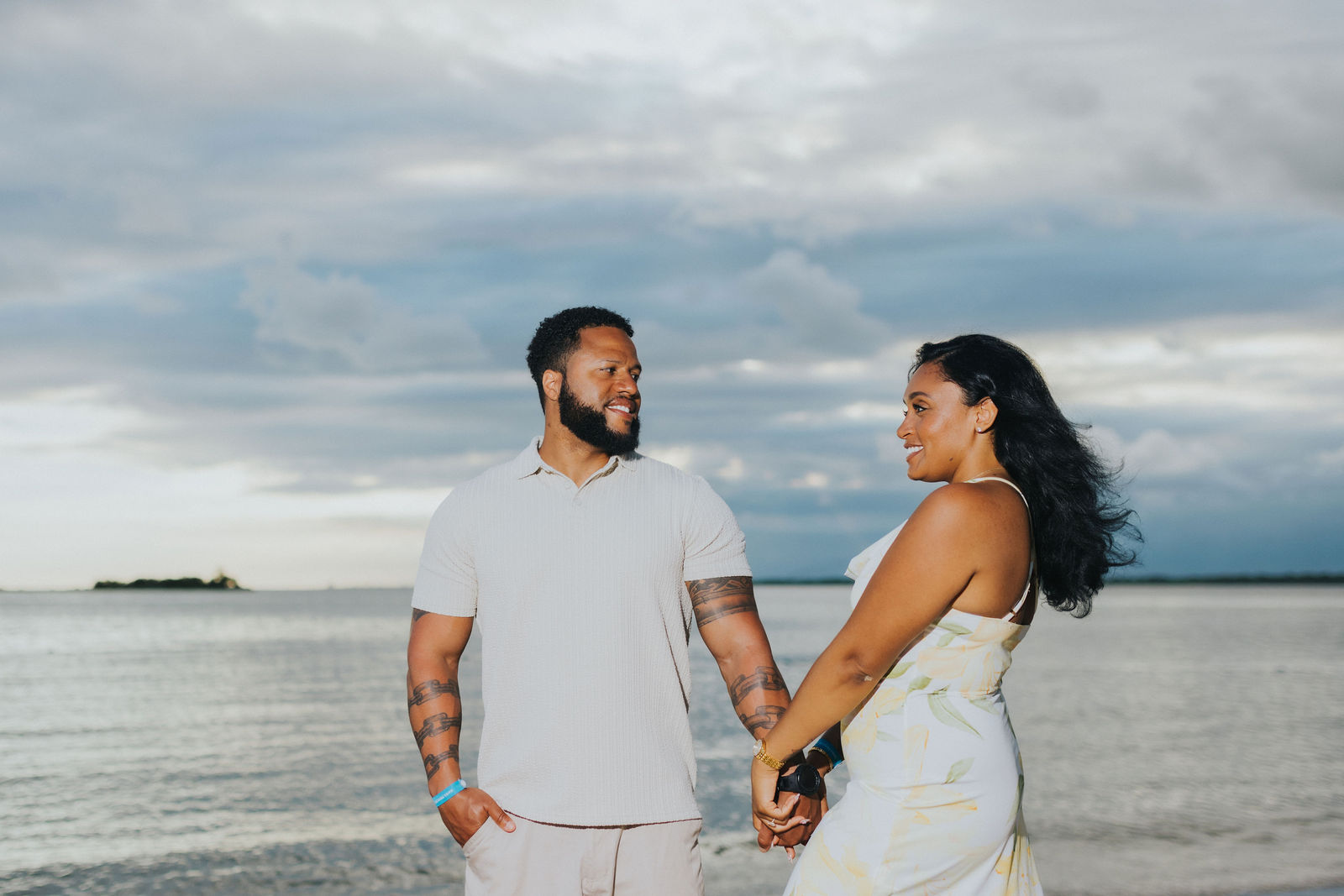 A proposal silhouette against a Caribbean sunset