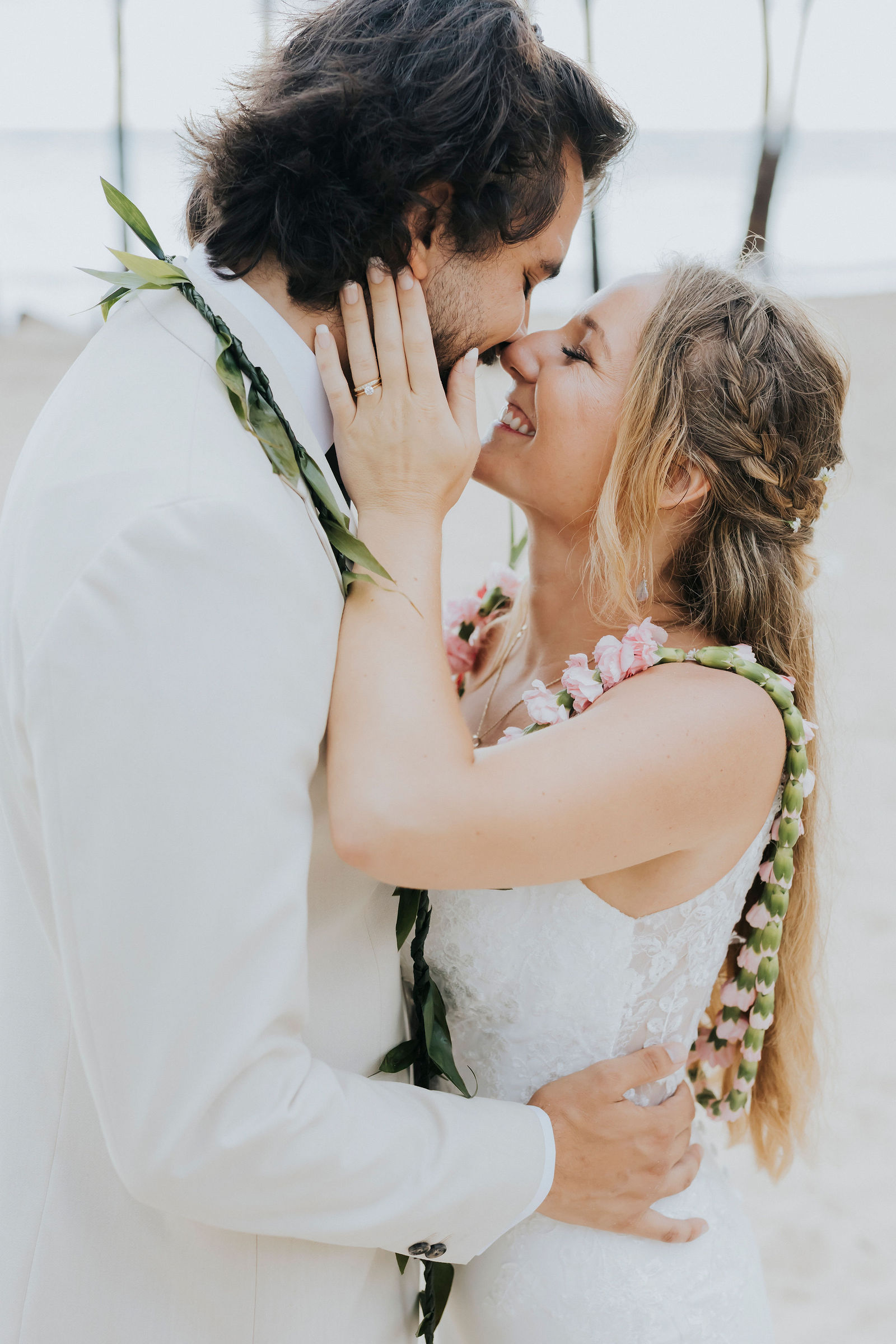 Newlyweds kissing on the Punta Cana beach