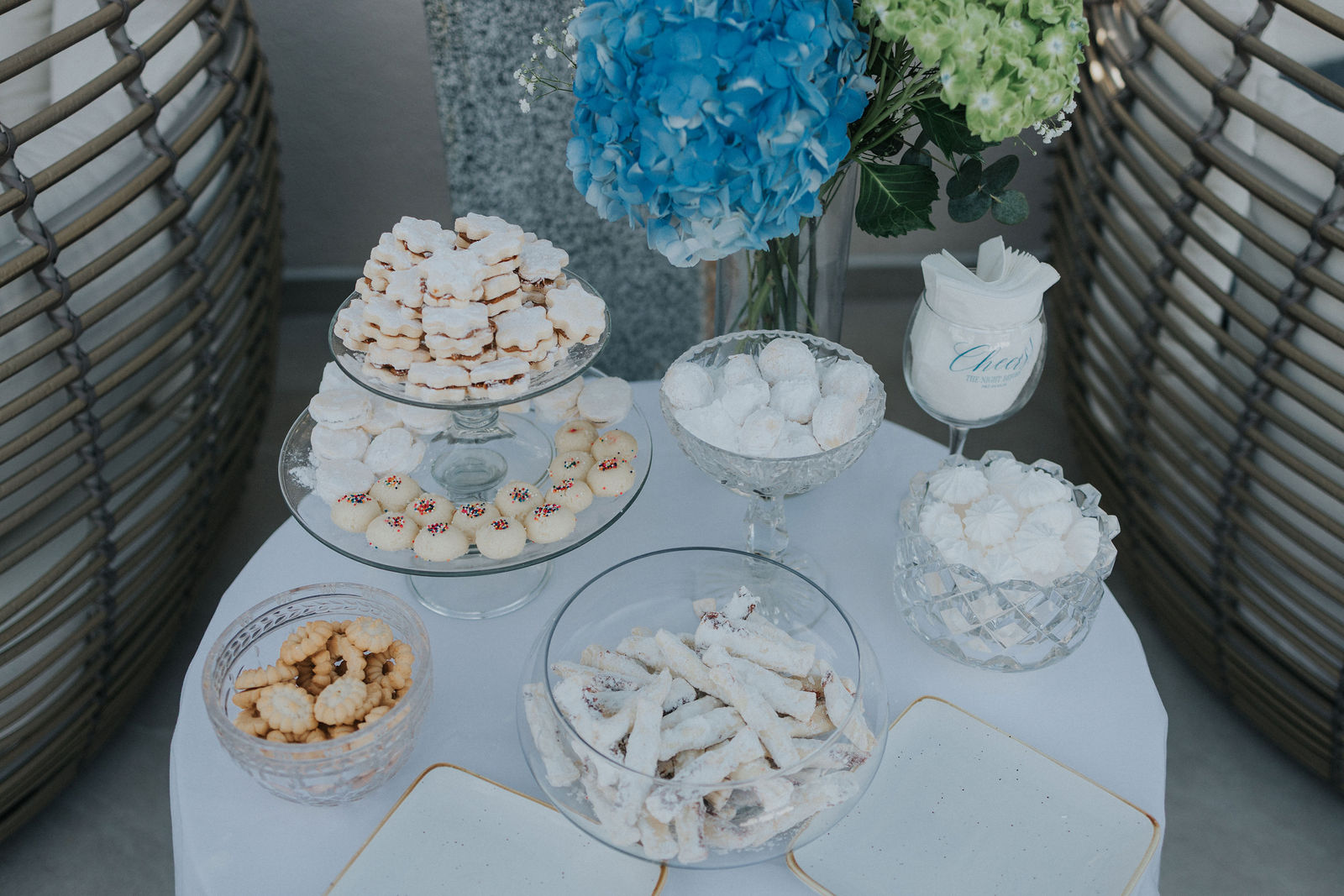 Dessert table with meringues and blue and white florals