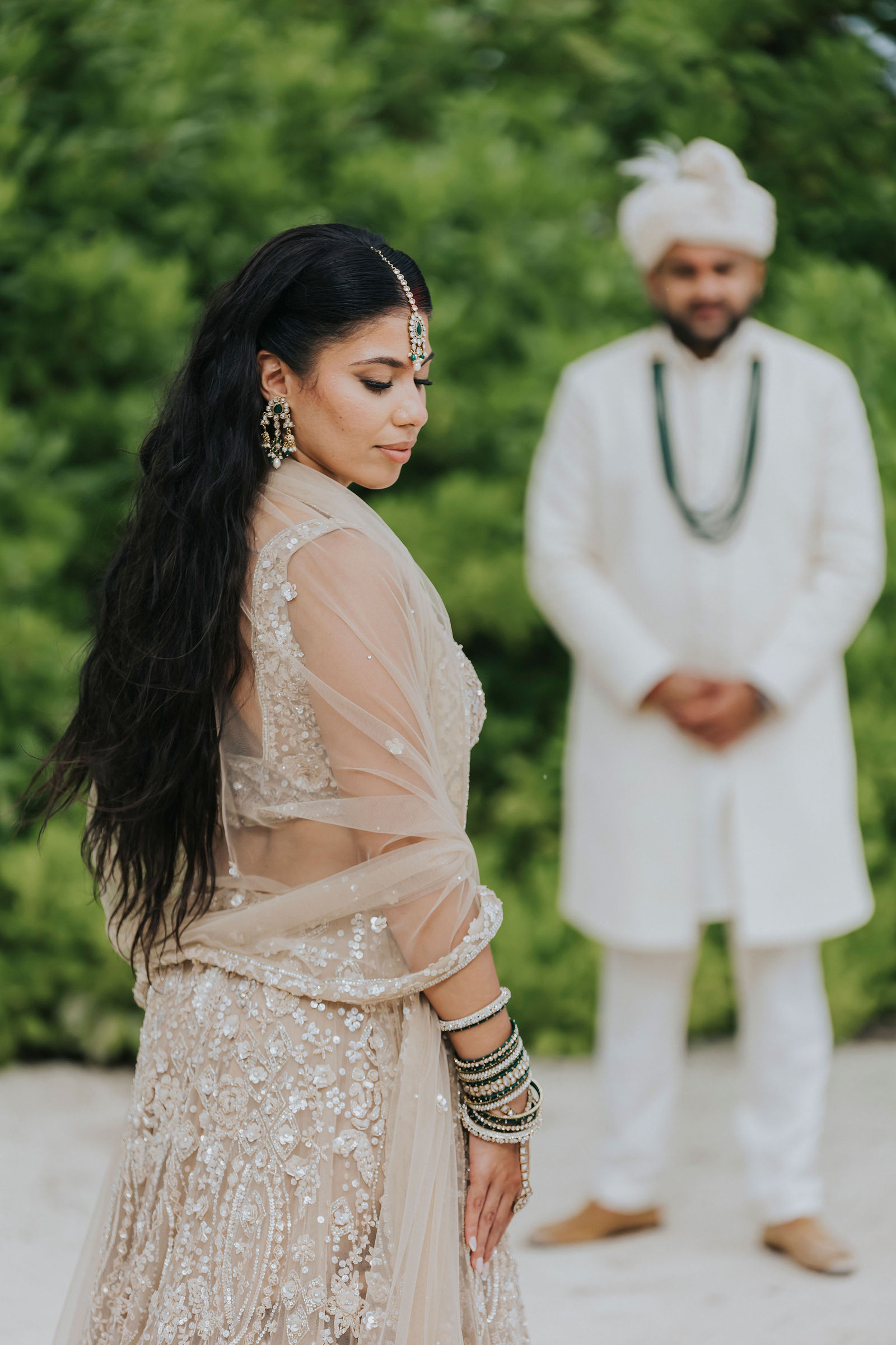 Bride portrait in profile with the groom standing behind her