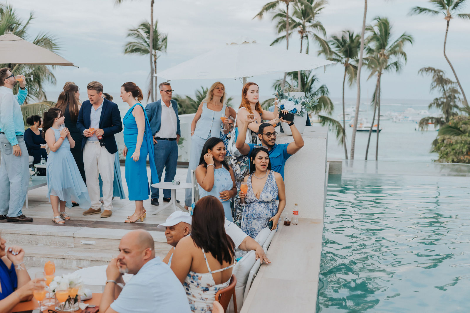 Guests gathered poolside above the Punta Cana shoreline