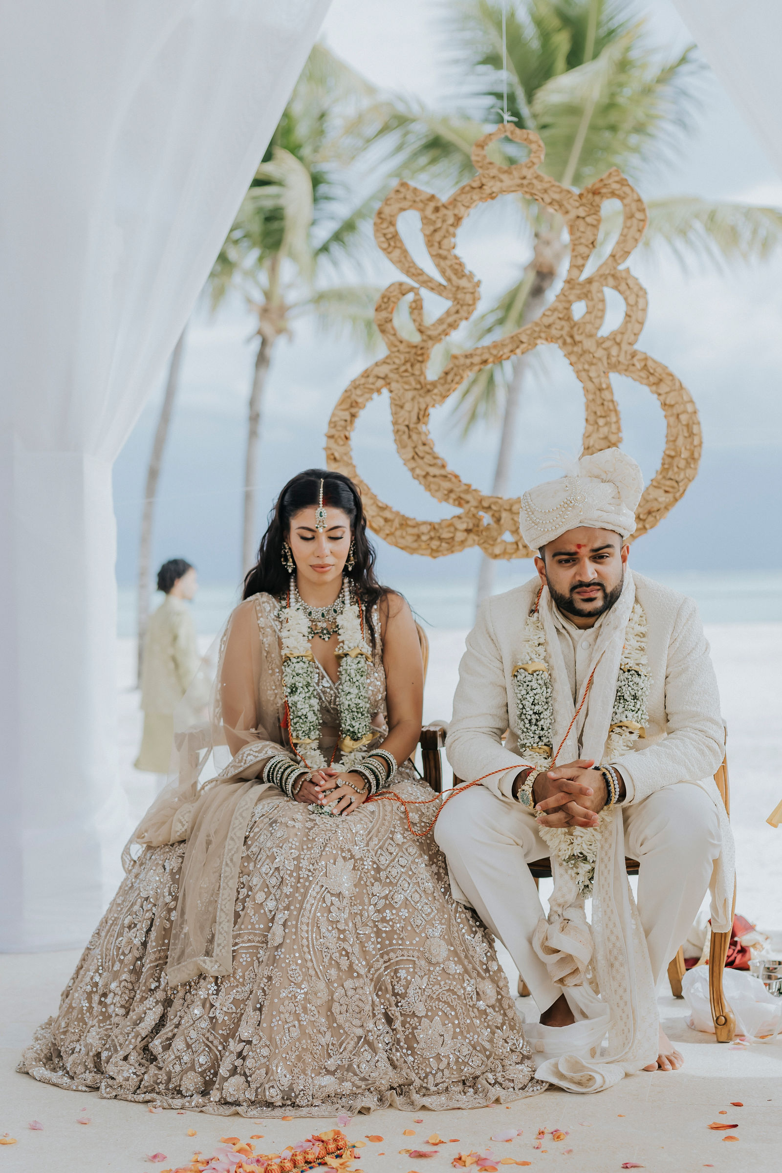 Bride and groom seated together at the mandap during the Hindu ceremony
