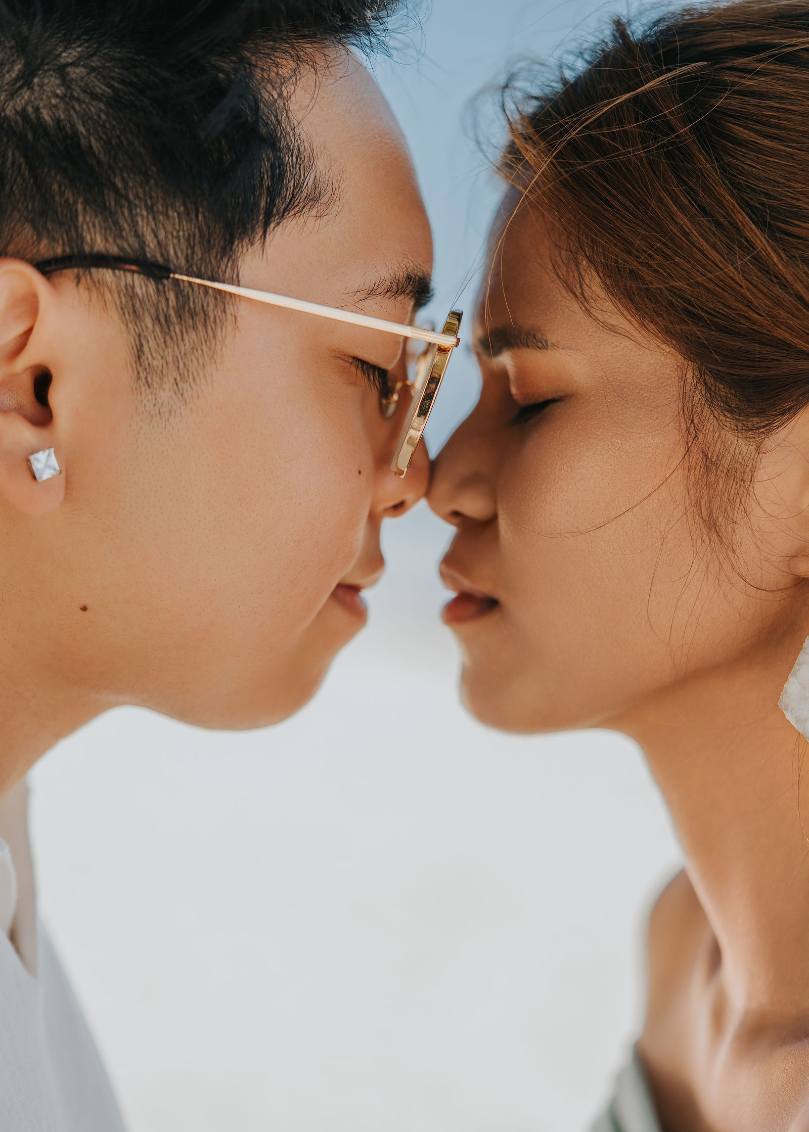 A celebration kiss after a water's-edge proposal