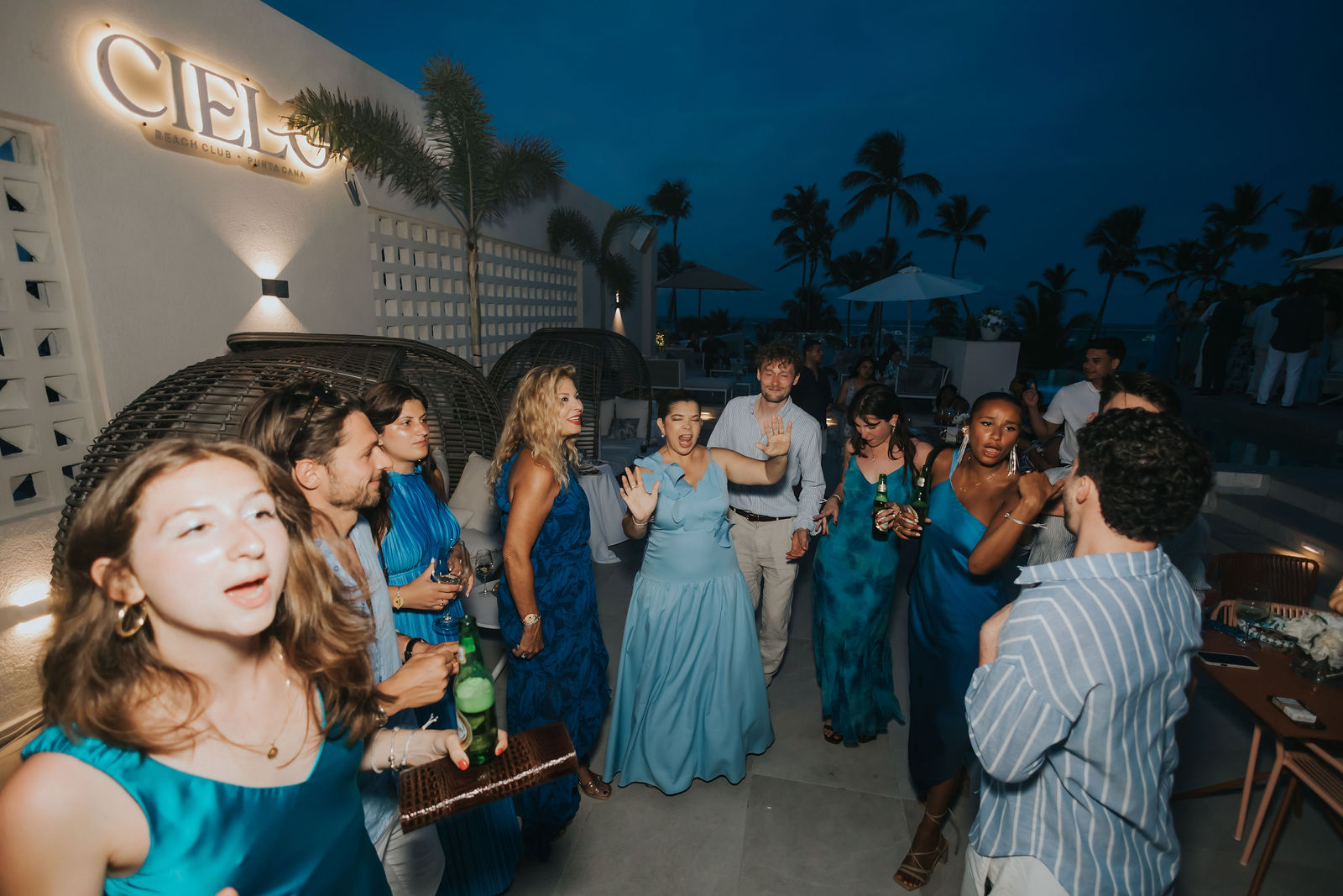 Guest laughing on the dance floor at blue hour