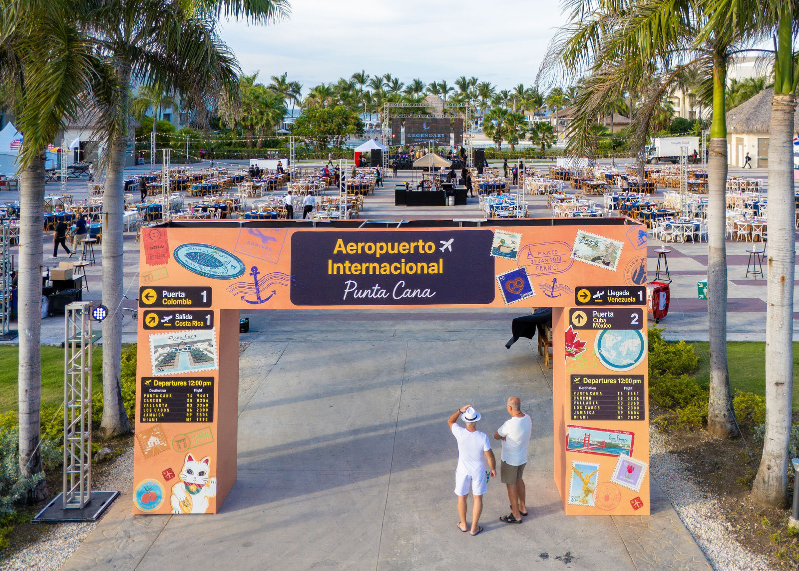 Guests arriving through the airport-themed welcome arch
