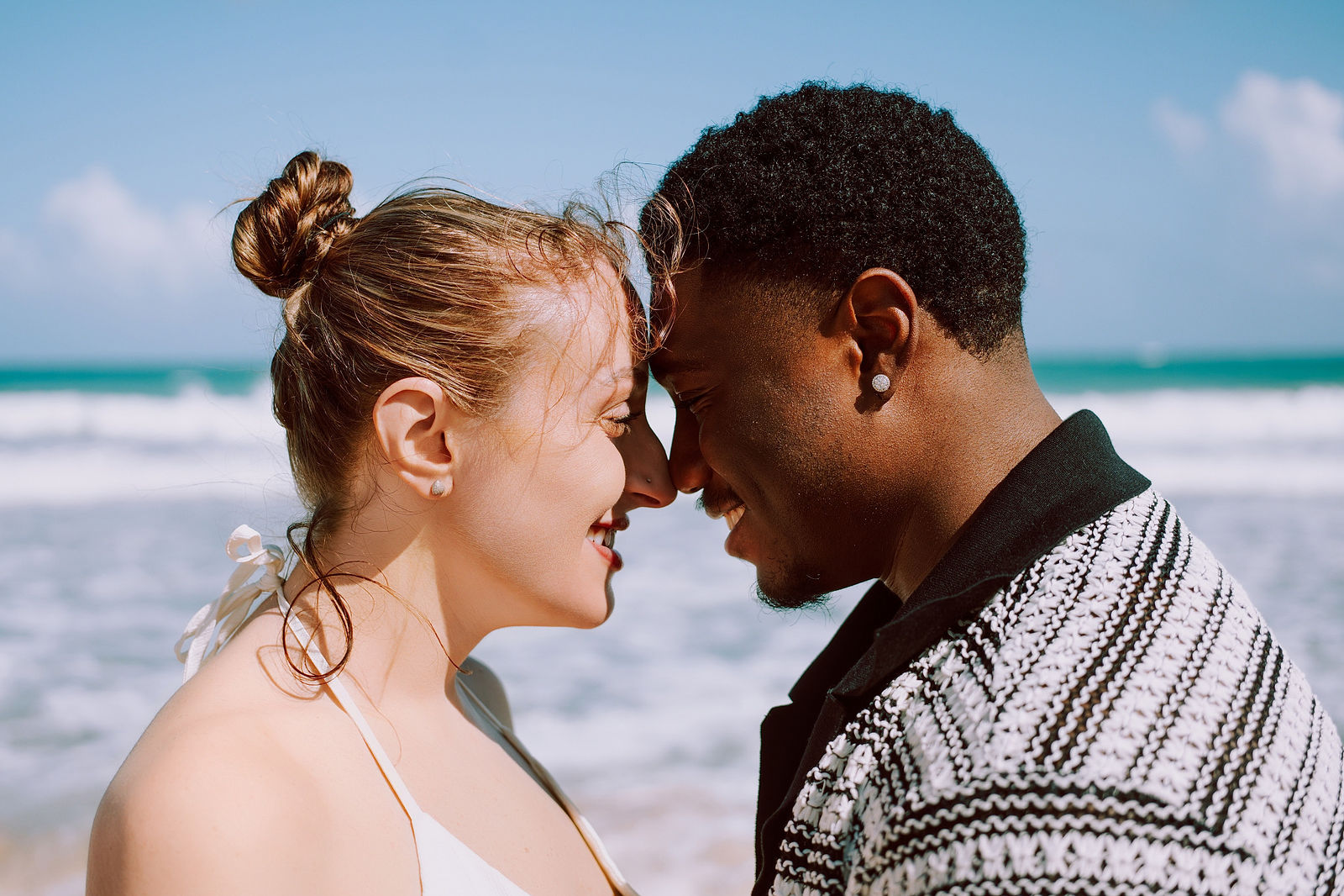 The couple resting foreheads together, eyes closed